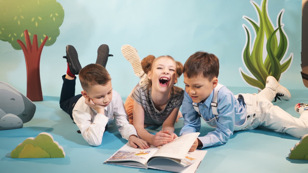 Crowd of children reading a book. Concept of a happy childhood