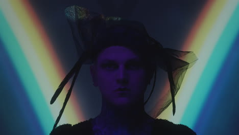 portrait of man in gothic veil with feathers
