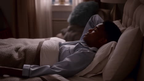 man relaxing in bed