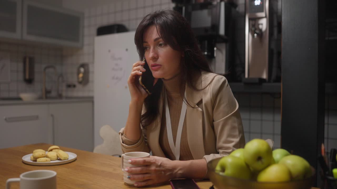 Woman on a Phone Call in Kitchen