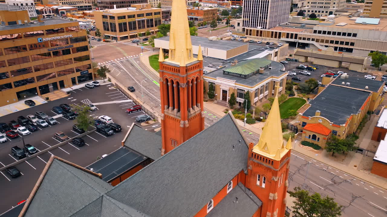 Colorado Springs, USA, 22 July 2025: Beautiful building of St. Mary's Cathedral and a parking lot nearby. Religious life of Colorado Springs, Colorado, USA. Aerial view