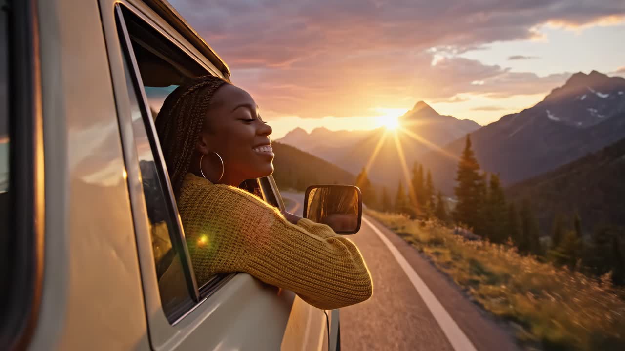 Woman enjoying a road trip at sunset