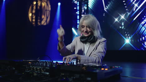 female dj performing at a music festival