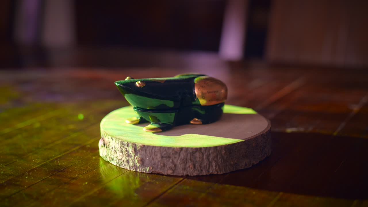 Close-up of a Handcrafted Green Wooden Frog Figurine