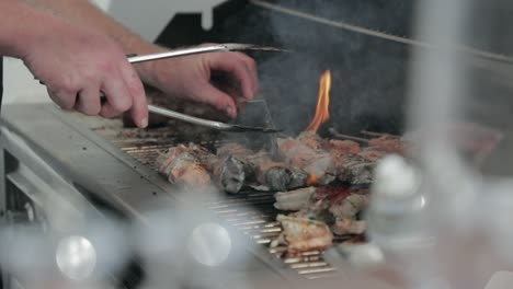 lamb chops sizzling on barbecue, slow motion