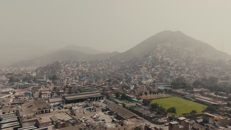 a sweeping view of the cityscape, with the horizon stretching over lima, peru - aerial drone shot