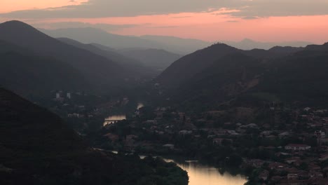 Breathtaking-view-in-evening-sun-on-old-capital-Mtskheta-and-river-Mktvari-in-Georgia