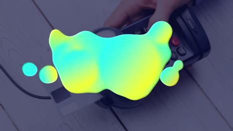 animation of colorful stain over payment terminal