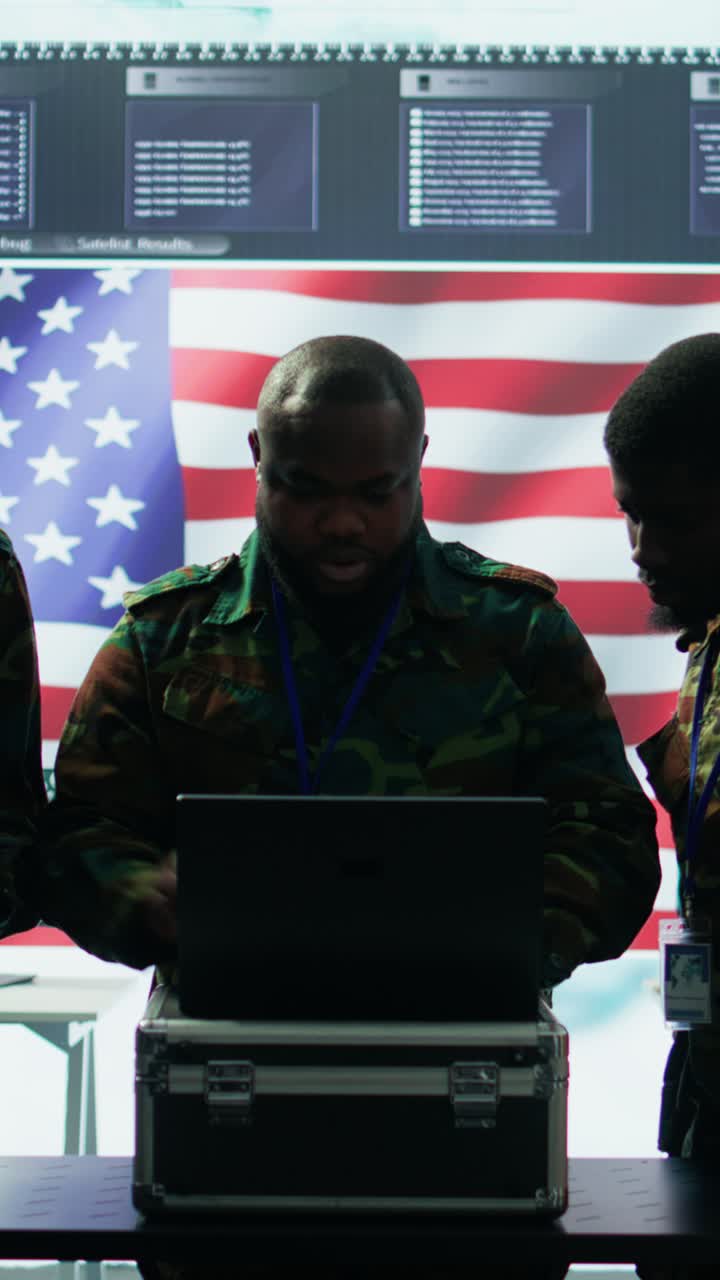 Vertical Video Military officer in a high tech control center engages in cybersecurity operations