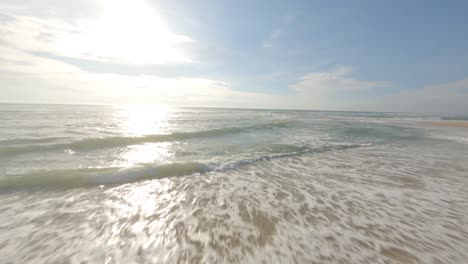 Crazy-drone-flying-on-Soustons-beach-and-around-two-surfers-walking-on-shore,-France