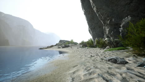 beautiful lake shore with a cliff in the background