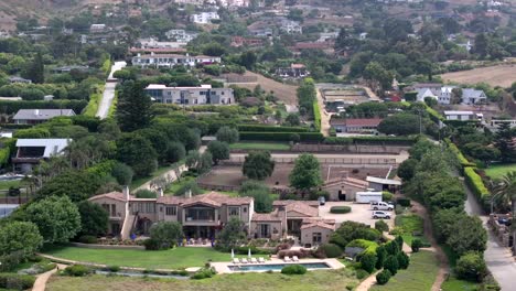 drone shot of luxury mansions on hillside neighborhood of malibu, california usa