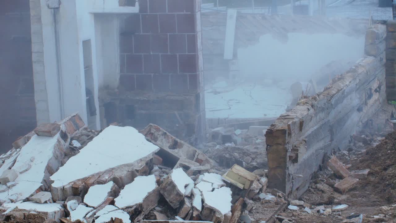 Brick Wall Collapses During Demolition Of An Old Wooden Building