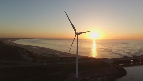 aerial: the oosterschelde storm surge barrier and windturbines in the netherlands