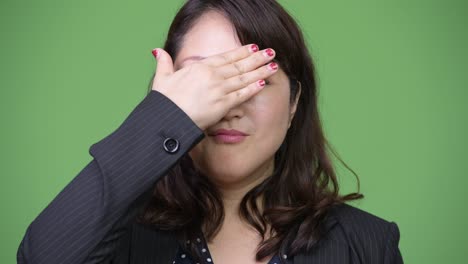mature beautiful asian businesswoman covering eyes as three wise monkeys concept