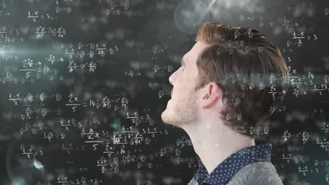 man thinking over mathematical equations.