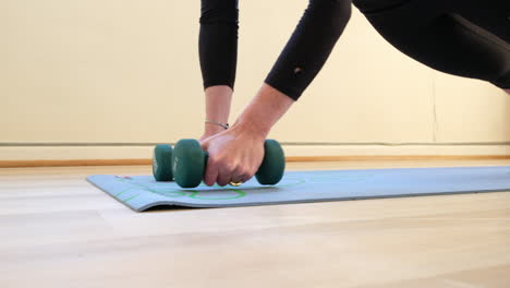 thirty something female doing core strength exercise in a home gym