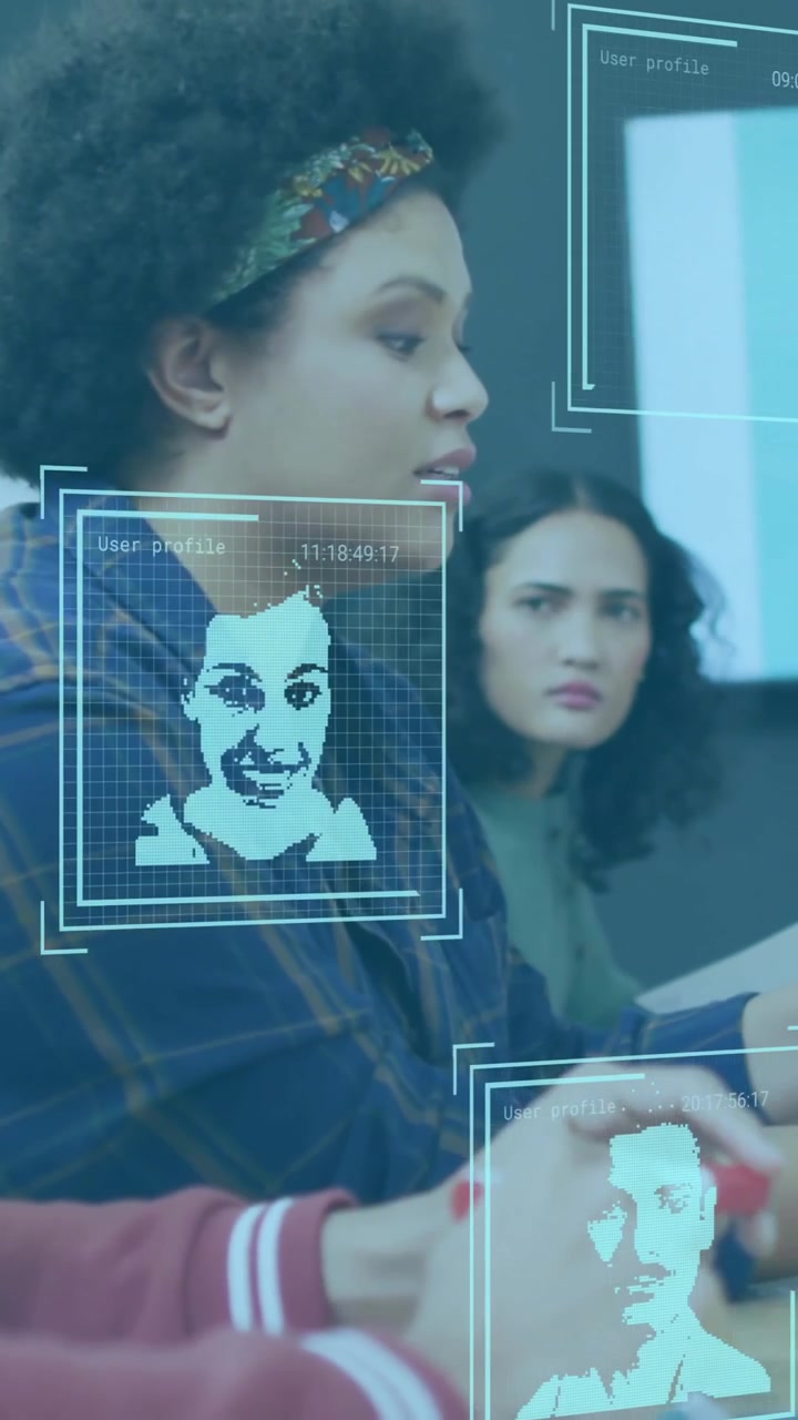 Facial recognition animation over diverse business team discussing in meeting room