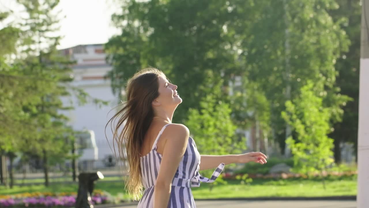 Happy Woman Walking in a Park