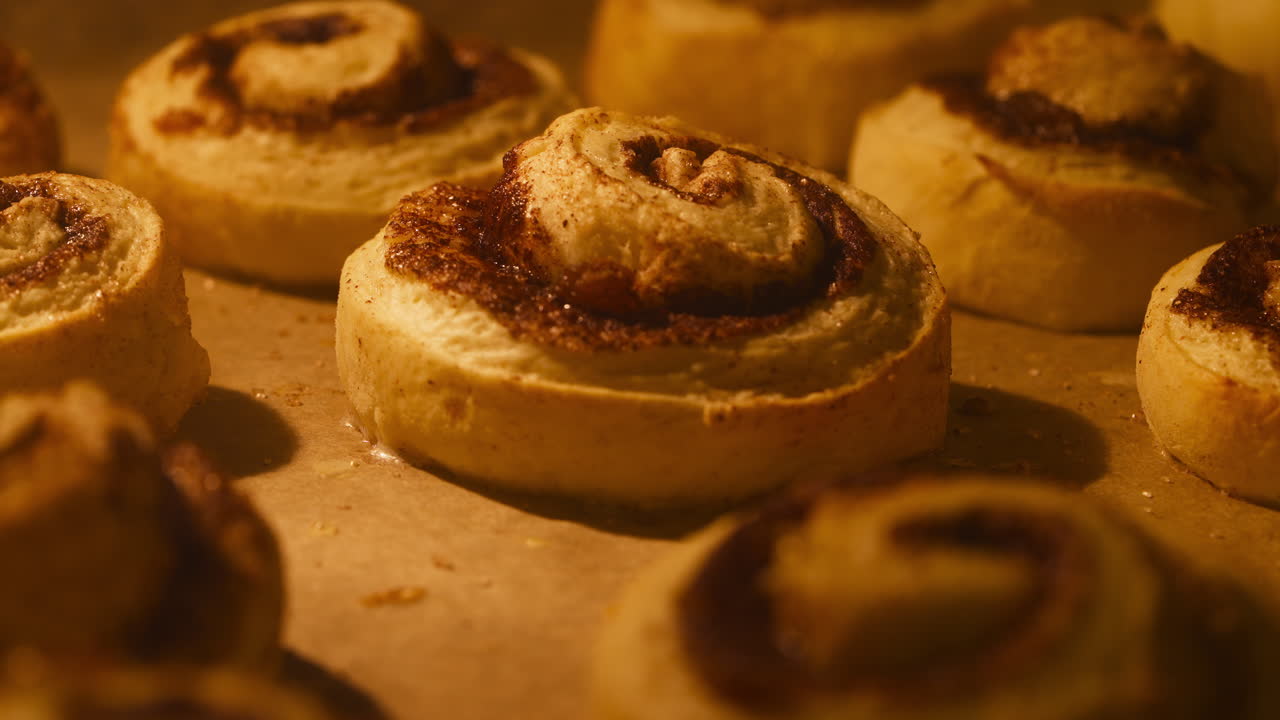 Cinnamon Rolls Rising While Cooking In Baking Oven. closeup shot, timelapse