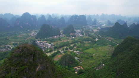 drone view of guilin mountains and cities around yulong river in yangshuo