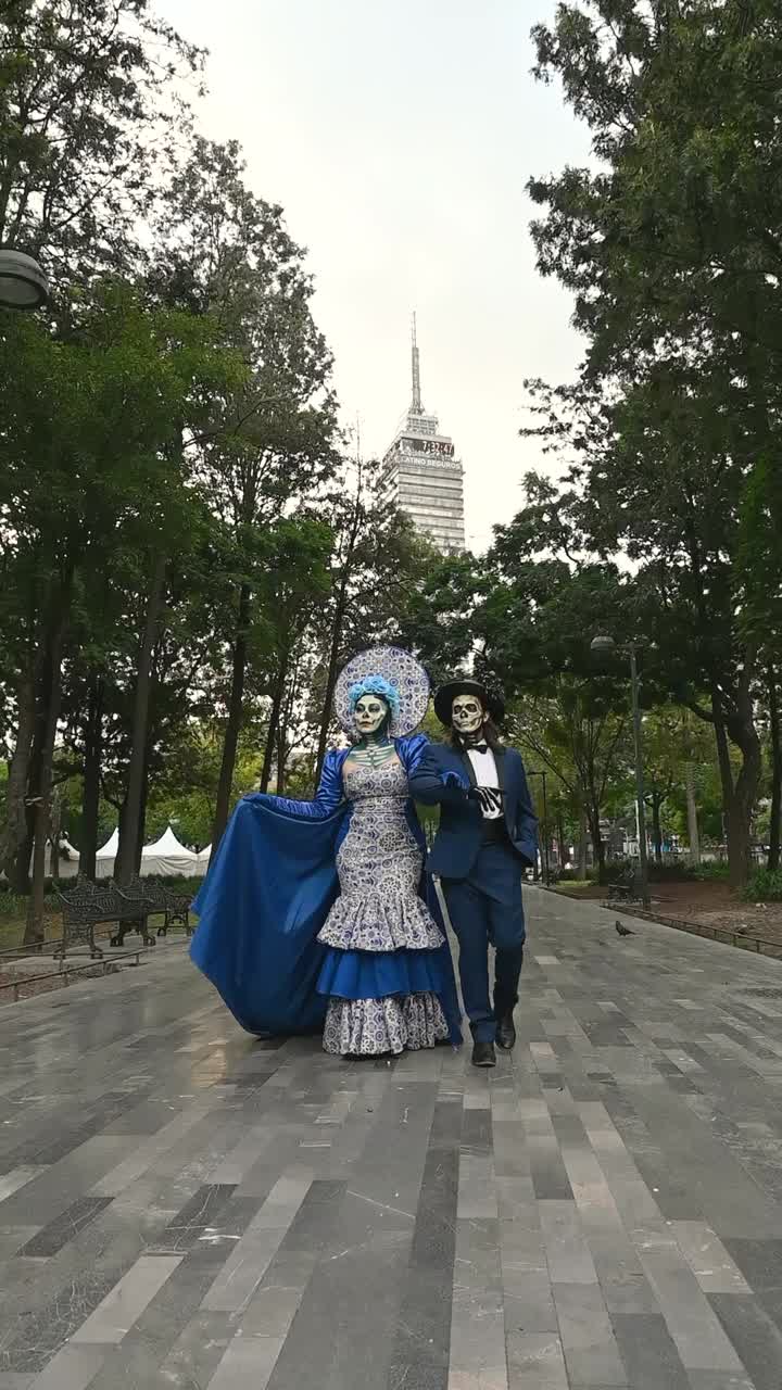 Day of the Dead, couple in vibrant costumes in the Alameda Central park during the Day of the Dead celebrations