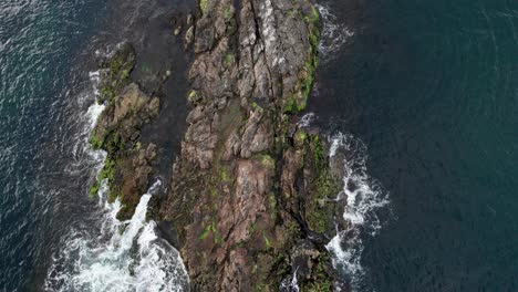 Waves-crashing-white-foaming-on-a-rock-in-the-ocean-water-of-Narragansett-Bay