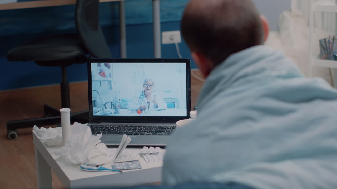 Sick man using video call telemedicine for consultation