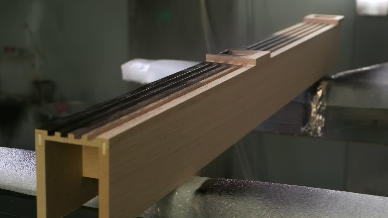 Close up of a wooden beam in a manufacturing setting