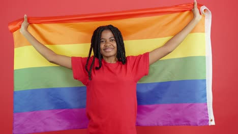 woman holding lgbtq pride flag