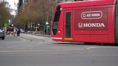 footage of melbourne australia iconic southern cross station junction traffics view with trams, cars and pedestrians - a corner view showcasing melbourne lifestyle.