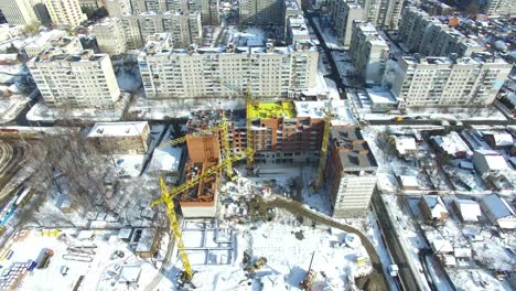 construction site with cranes. under construction high-rise building with construction cranes