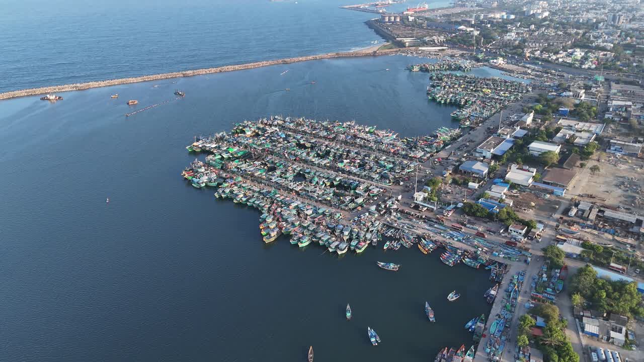 Aerial drone shot of fishing boats tied close together near north chennai harbour
