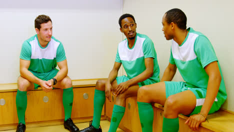 athletes having a discussion in the locker room 4k