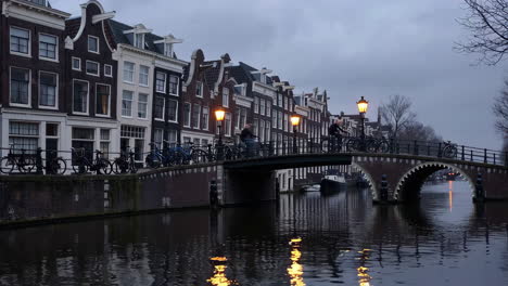 amsterdam canal bridge at dusk