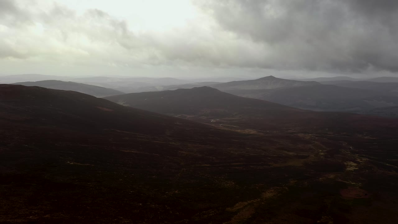 Spectacular Aerial view of Sally Gap, Wicklow Mountains, Ireland, February 2020. Drone pushes forward slowly over peat bog landscape.