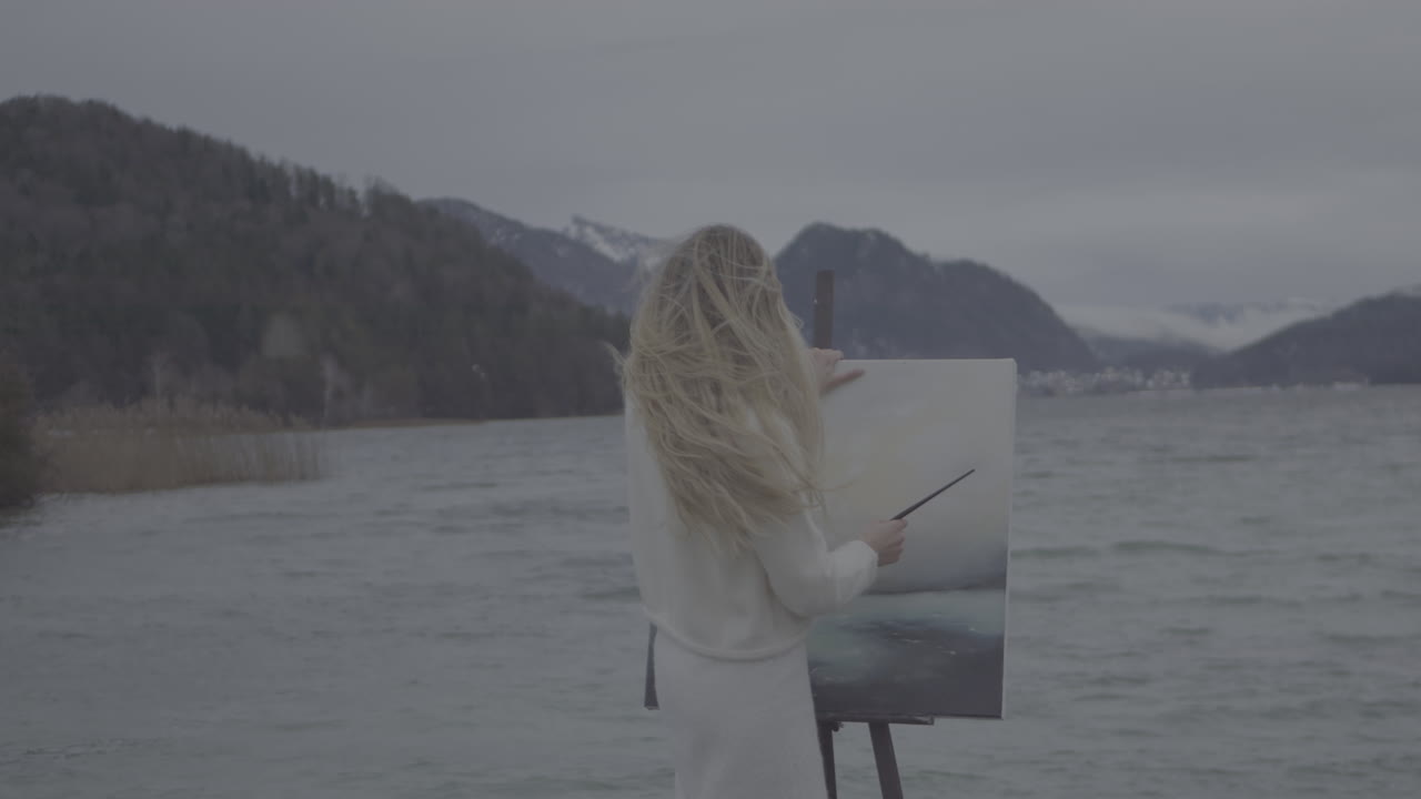 Woman Painting a Lakeside Landscape