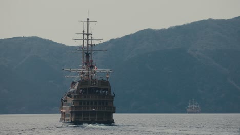 hakone sightseeing cruise - pirate-style ship cruising on lake ashi in hakone, japan