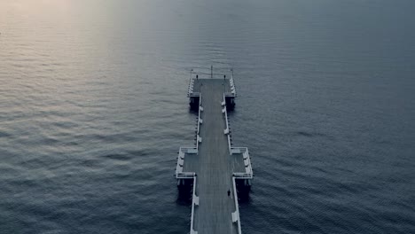 aerial footage over molo, pier during sunrise