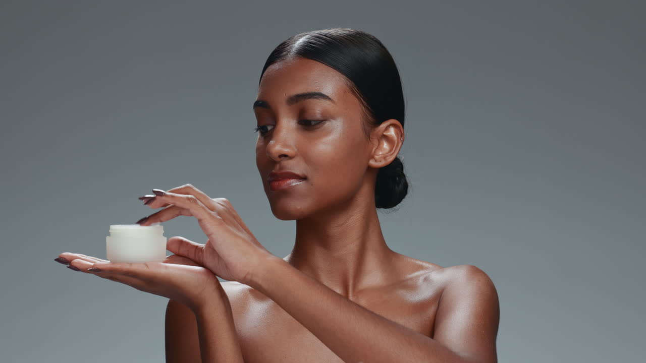 Beauty, cream and face portrait of a woman