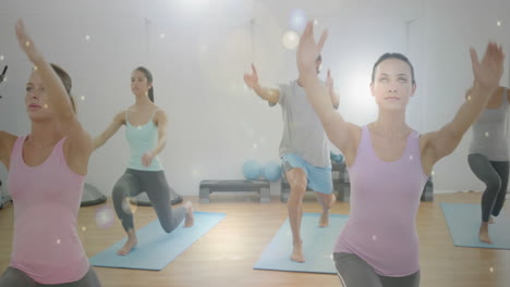 people practicing yoga in studio with glowing light particles animation