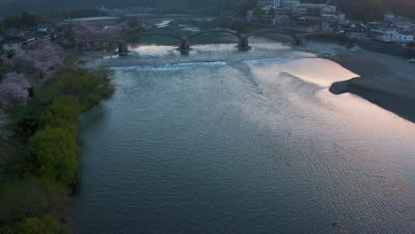 Misty-Spring-Morning-in-Iwakuni,-Aerial-Tilt-Shot-at-Dawn-in-Japan