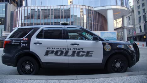 A-Police-Car-Parked-in-Front-of-the-Building-in-Vancouver,-British-Columbia,-Canada---Close-Up