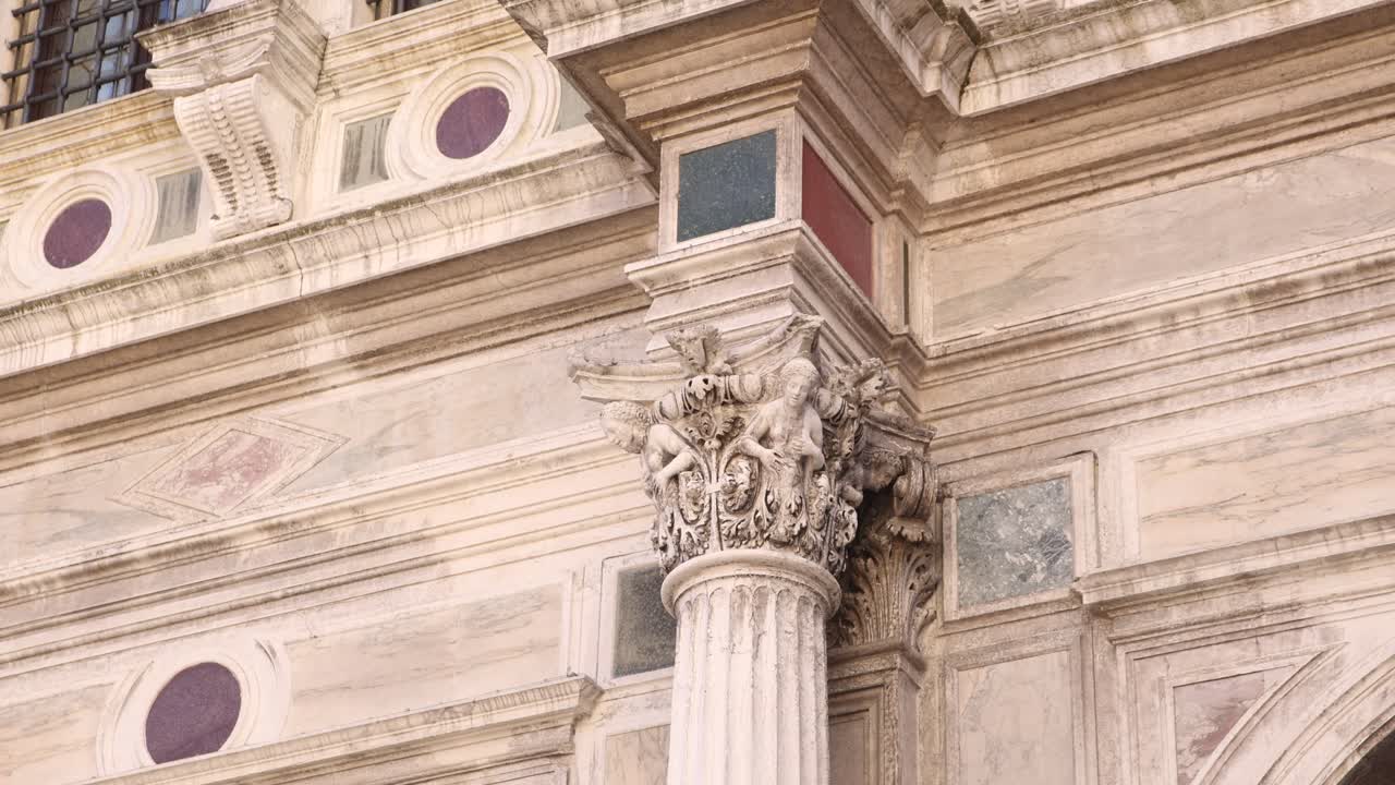 Intricate Corinthian column with sculpted details in Venetian architecture. Venice, Italy