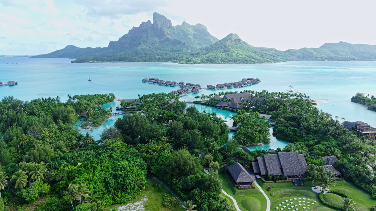 Bora Bora, French Polynesia. Aerial View of Luxury Resort With Overwater Villas and View of Main Island and Lagoon