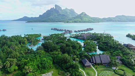 Bora Bora, French Polynesia. Aerial View of Luxury Resort With Overwater Villas and View of Main Island and Lagoon