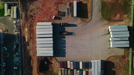 top down aerial of parking lot of semi trailers in south atlana, georgia