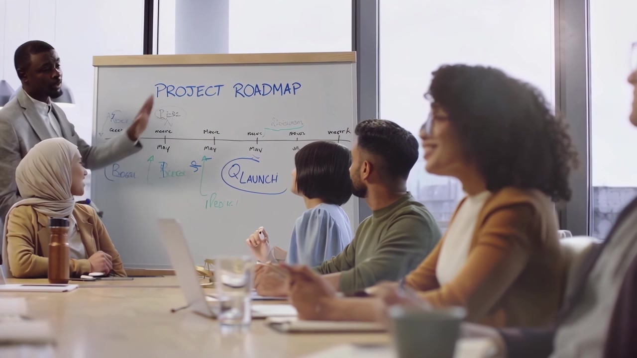 Diverse Team Collaborating on Project Roadmap in Modern Office