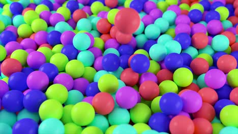 colorful 4k 3d animation from a pile of abstract spheres and balls rolling and falling from top to bottom.