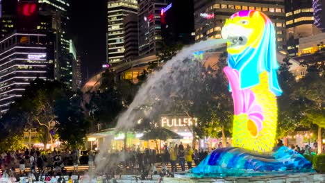 people at merlion park with light painting at